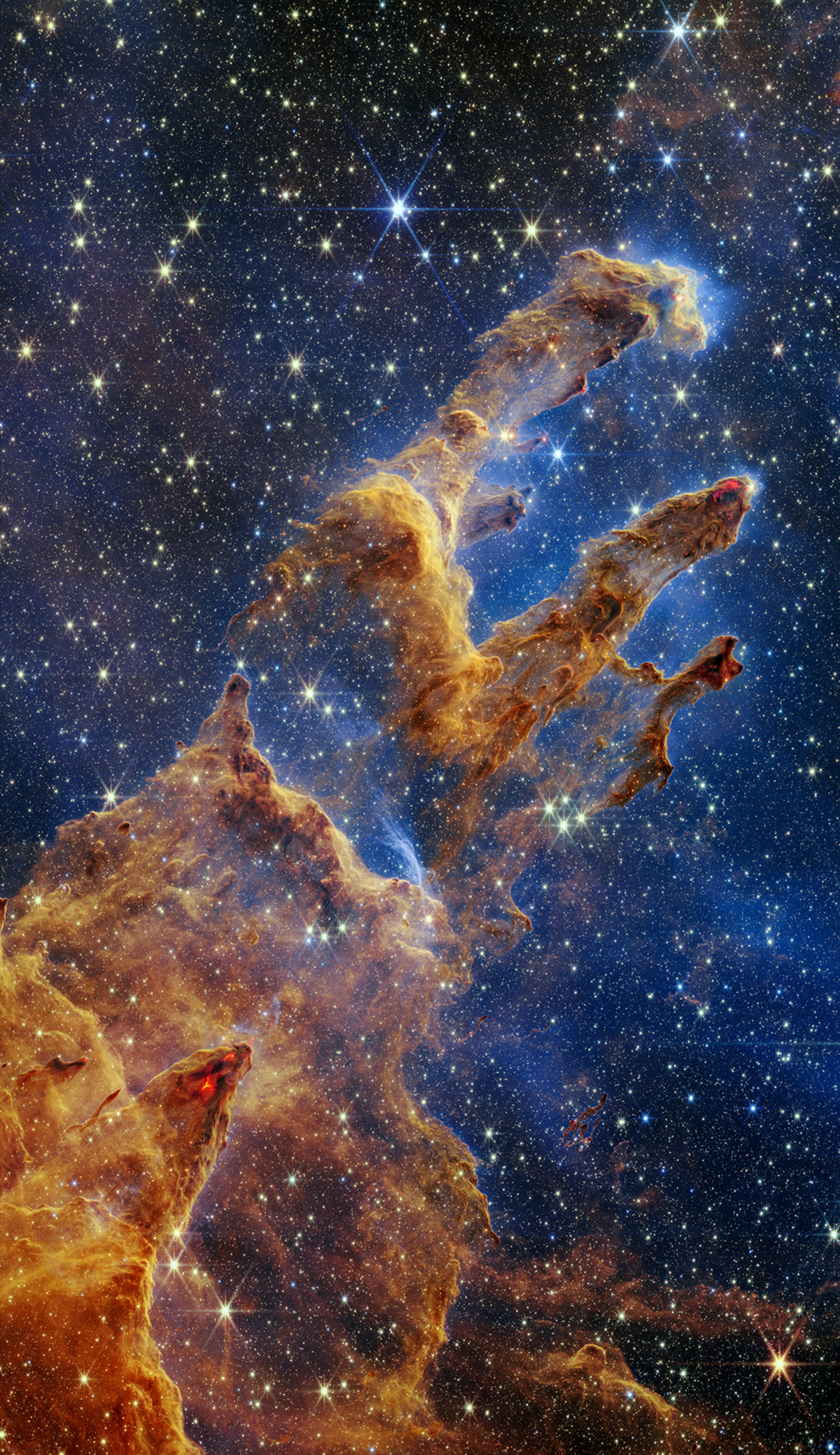 Pillars of Creation captured by the James Webb Space Telescope — towering columns of interstellar gas and dust in the Eagle Nebula